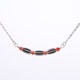 Silver Bar Necklace with Three Tubular Rice Beads and Red Swarovski Crystals